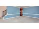 Open living room with blue walls, staircase, and view of the adjacent room at 748 Weathergreen Dr, Raleigh, NC 27615