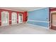 Bright living area showcasing a staircase, and a doorway to another room at 748 Weathergreen Dr, Raleigh, NC 27615