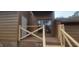 Wooden porch with brick base, and light brown doors for outdoor access at 806 Kendall Dr, Durham, NC 27703