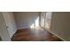 Bright bedroom featuring wood-look floors and a door to private outdoor deck at 806 Kendall Dr, Durham, NC 27703