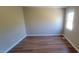 This room features a window allowing for light and wood-look flooring throughout at 806 Kendall Dr, Durham, NC 27703