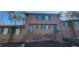 A two-story townhouse with light brown siding and green shutters is centrally located at 806 Kendall Dr, Durham, NC 27703