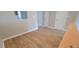 An open hallway offers easy access to different rooms and has light wood flooring at 806 Kendall Dr, Durham, NC 27703