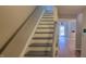 Clean stairs lead up to the next floor and open to the lower level at 806 Kendall Dr, Durham, NC 27703