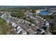 Aerial view showcases a community with beautiful landscaping, green spaces, and well-maintained homes and roadways at 857 Stroud Cir, Wake Forest, NC 27587