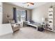 This sunny bedroom has a bed and reading chair, with bright toys lining the walls at 857 Stroud Cir, Wake Forest, NC 27587
