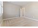 This bedroom features neutral walls, carpeted floors, and a large window at 857 Stroud Cir, Wake Forest, NC 27587