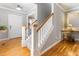 Welcoming foyer featuring hardwood floors, staircase, and stylish decor at 857 Stroud Cir, Wake Forest, NC 27587