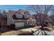 Charming two-story home with a welcoming front porch and well-manicured lawn at 857 Stroud Cir, Wake Forest, NC 27587