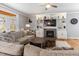 Inviting living room with a cozy fireplace, built-in shelving, and a comfortable sectional at 857 Stroud Cir, Wake Forest, NC 27587