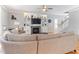 Bright living room with a fireplace, custom built-ins, and a large comfortable sectional sofa at 857 Stroud Cir, Wake Forest, NC 27587