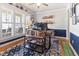 Cozy home office with natural light, built-in shelves, and a comfortable workspace at 857 Stroud Cir, Wake Forest, NC 27587