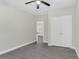 The bedroom features gray floors, a ceiling fan, and a closet for storage at 915 E Holly St, Rocky Mount, NC 27801
