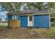 Blue siding and a white door accent the exterior of this quaint home at 915 E Holly St, Rocky Mount, NC 27801