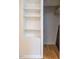 Organized closet with built-in shelving and hardwood floors for ample storage at 979 St Marys St # G6, Raleigh, NC 27605