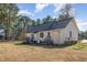 The home's exterior features a well-kept lawn, classic design, and a deck for outdoor enjoyment at 1001 Strobus Ct, Wendell, NC 27591