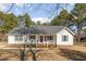 Charming single-story home featuring a welcoming front porch, brick foundation, and manicured lawn at 1001 Strobus Ct, Wendell, NC 27591