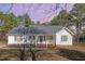Charming single-story home featuring a welcoming front porch, brick foundation, and manicured lawn at 1001 Strobus Ct, Wendell, NC 27591