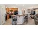 Open-concept kitchen with breakfast bar, and connection to dining area at 1001 Strobus Ct, Wendell, NC 27591