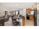 Inviting living room area with modern furnishings and a view of the kitchen island and barstool seating at 1001 Strobus Ct, Wendell, NC 27591