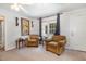 Cozy living area with plush armchairs, large window with curtains, and neutral carpet at 1001 Strobus Ct, Wendell, NC 27591