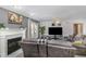 Inviting living room features a fireplace, comfortable seating, large TV, and access to an outdoor patio at 1001 Strobus Ct, Wendell, NC 27591