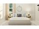 Tranquil bedroom with light blue accents, wooden nightstands, and a round mirror at 1012 Aspen View Dr, Raleigh, NC 27610