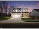 Charming two-story home with a well-manicured lawn and welcoming front porch at 1012 Aspen View Dr, Raleigh, NC 27610