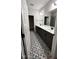 Elegant bathroom featuring patterned tile floors and a double vanity sink at 1013 Greatland Road, Durham, NC 27703