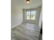 Bright room with wood-look floors and natural light, providing a cozy atmosphere at 1013 Greatland Road, Durham, NC 27703