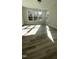 Bright living room featuring hardwood floors and large windows that stream in natural light at 1013 Greatland Road, Durham, NC 27703