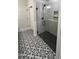 Modern tiled shower with glass enclosure at 1013 Greatland Road, Durham, NC 27703