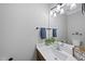 Bathroom with vanity, sink, modern light fixture, and neutral wall color at 107 White Sands Dr, Cary, NC 27513