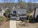 Aerial front view showcasing the home's brick facade, landscaping, and driveway at 107 White Sands Dr, Cary, NC 27513