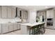 Stylish kitchen featuring an island with seating, stainless steel appliances, and white subway tile backsplash at 1112 Topaz Cave Cir, Raleigh, NC 27610