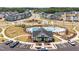 Aerial view of a community pool and playground with surrounding homes and green spaces at 1205 Jade Valley Trl, Raleigh, NC 27610