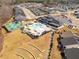 Aerial view of community amenities: pool, clubhouse, tennis court, along with beautifully planned walkways and homes at 130 Ivory Ln, Raleigh, NC 27610