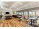 Clubhouse with bar, tables, seating and a television for community use and resident recreation at 130 Ivory Ln, Raleigh, NC 27610
