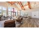 Bright clubhouse with a cathedral ceiling, chandeliers, wood beams, comfortable seating and hardwood floors at 130 Ivory Ln, Raleigh, NC 27610