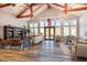 Bright clubhouse with a cathedral ceiling, chandeliers, wood beams, comfortable seating and a large front window at 130 Ivory Ln, Raleigh, NC 27610