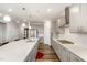 Spacious open concept kitchen with large center island, stainless steel appliances, and subway tile backsplash at 130 Ivory Ln, Raleigh, NC 27610