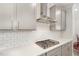 Modern kitchen features white subway tiles, gray cabinets, quartz countertops, and stainless steel range hood at 130 Ivory Ln, Raleigh, NC 27610