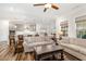 Open-concept living space with hardwood floors connecting to the kitchen and dining area at 130 Ivory Ln, Raleigh, NC 27610