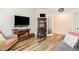 Comfortable living room with wood floors, large TV, and plenty of seating, perfect for relaxation at 130 Ivory Ln, Raleigh, NC 27610