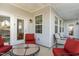 Covered patio with comfortable seating and view of the backyard at 130 Ivory Ln, Raleigh, NC 27610
