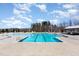 Large community swimming pool with clearly marked lanes, ample deck space, and nearby gazebo at 130 Ivory Ln, Raleigh, NC 27610
