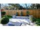 Secluded backyard featuring stone patio and beautiful green landscaping at 1317 Pecora Ln, Raleigh, NC 27607