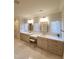 Bright bathroom featuring double vanity sinks, large mirrors, and natural lighting at 1317 Pecora Ln, Raleigh, NC 27607