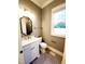 Bathroom showcasing a vanity, toilet, bronze hardware and a window providing natural light at 1317 Pecora Ln, Raleigh, NC 27607