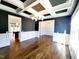 Elegant dining room features wainscoting, dark walls and coffered ceilings at 1317 Pecora Ln, Raleigh, NC 27607